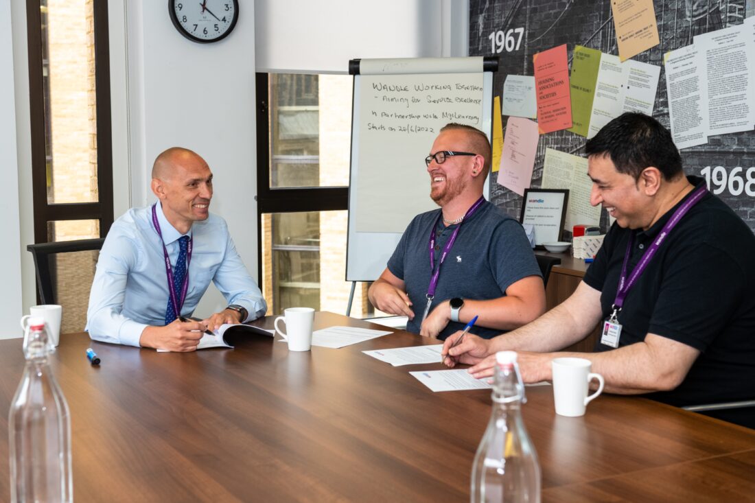 Wandle colleagues smiling meeting