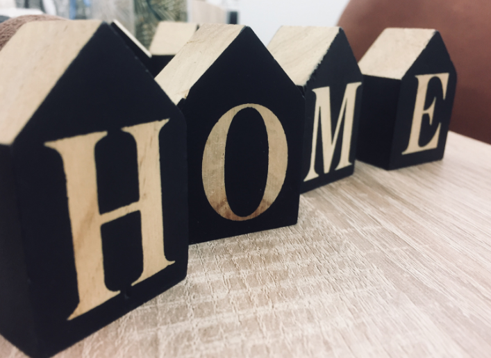 Wooden houses with HOME written on them